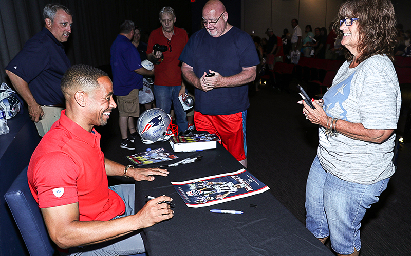 Fans getting autographs from Patriots players.