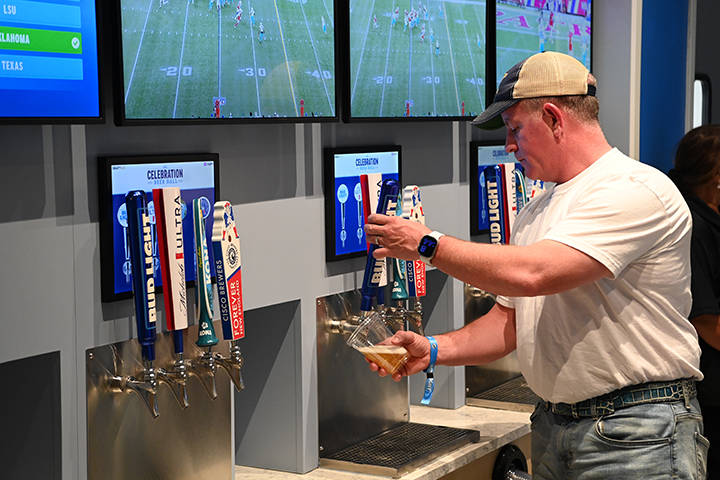 Fan pouring beer at the Celebration Beer Hall.