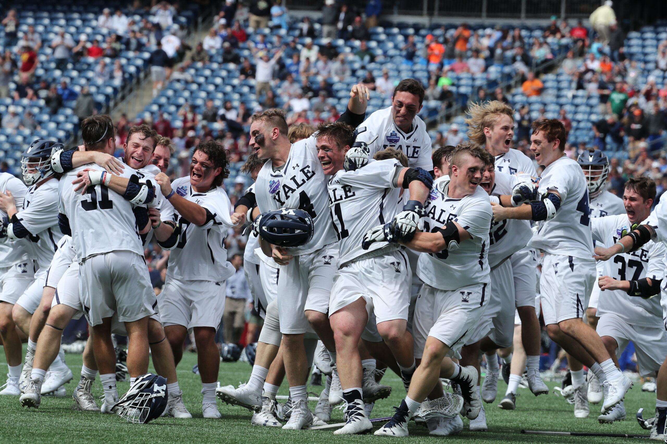 Lacrosse team celebrating.