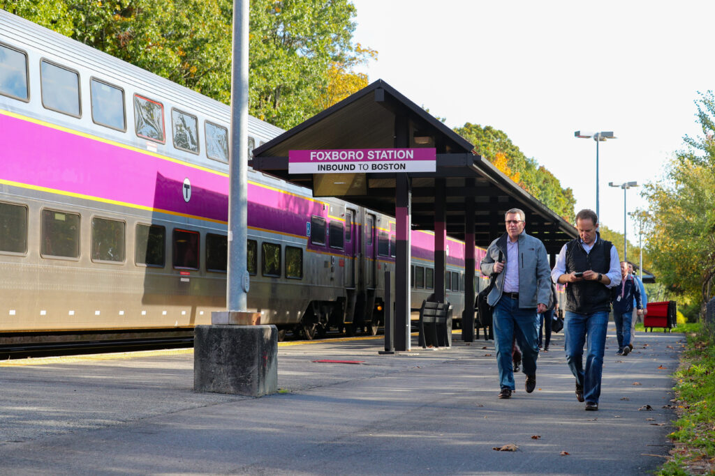 Fan walking from the MBTA train station.