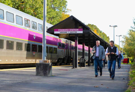 Fan walking from the MBTA train station.