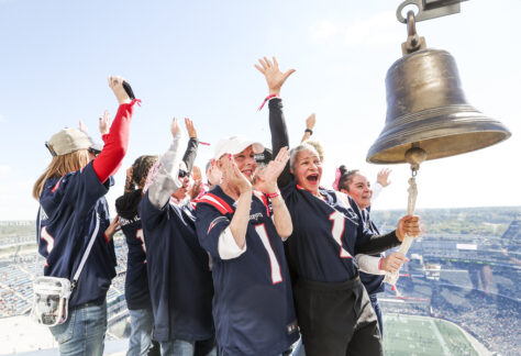 Day of Pampering Cancer Survivors ringing the bell.