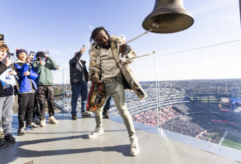 WWE superstar Kofi Kingston ringing the bell as keeper of the light on December 1.
